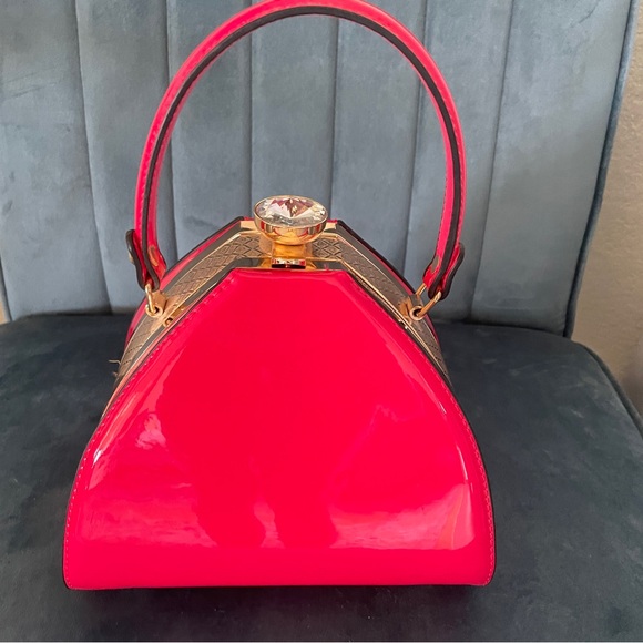 Handbags - Hot pink handbag with gem clasp.